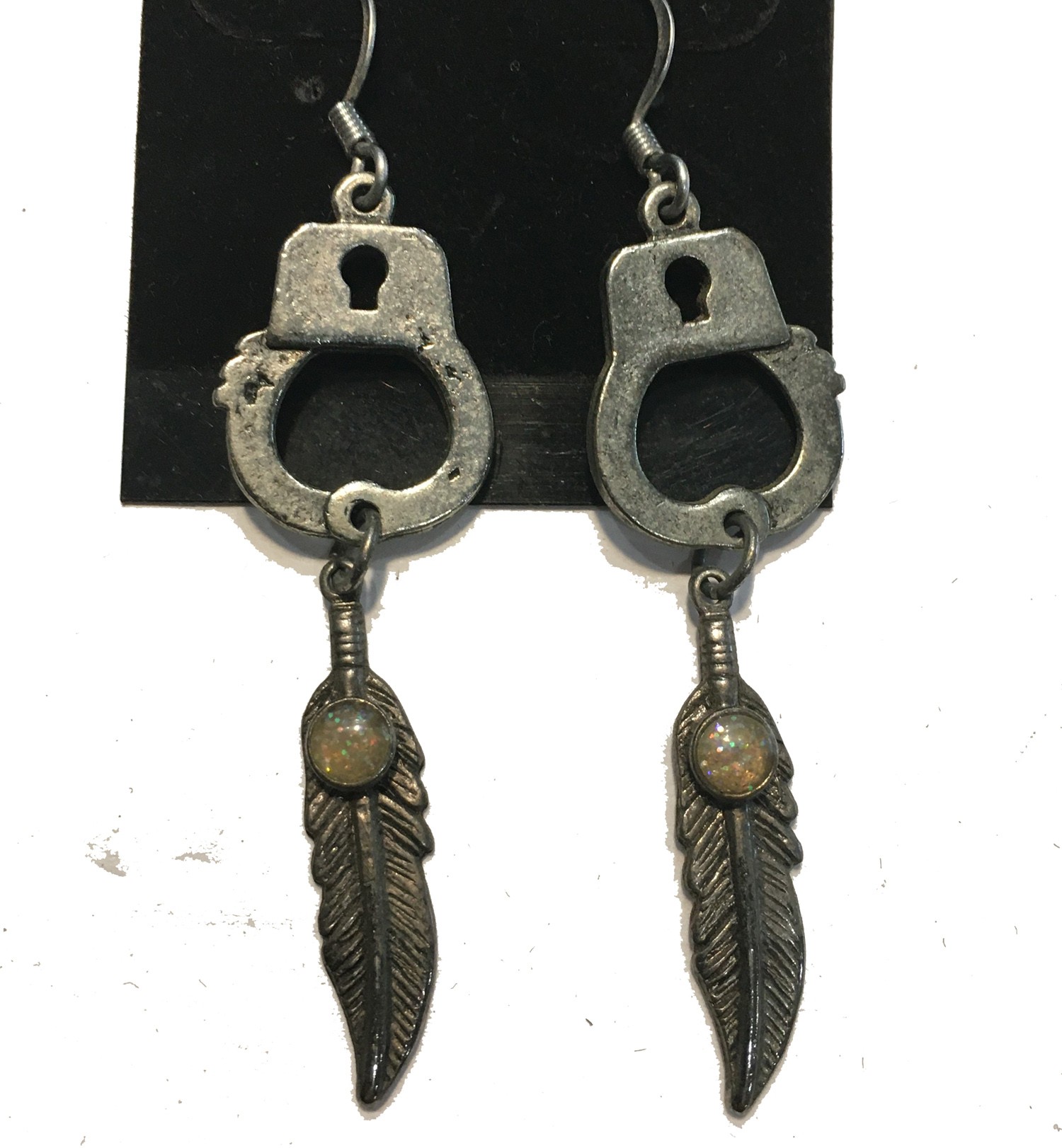 HANDCUFF SINGLE WITH FEATHER WITH  OPAL ACCENT EARRINGS STAINLESS STEEL